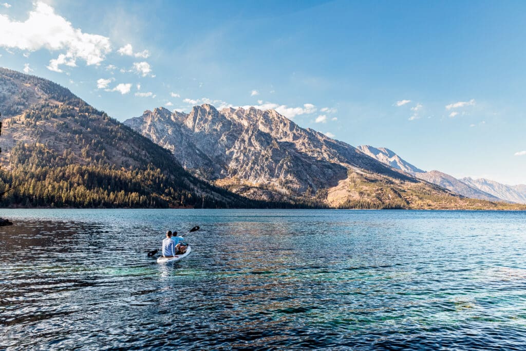 Panoramic sequence of Jenny Lake showing crystal clear water and mountain reflections in Grand Teton National Park.