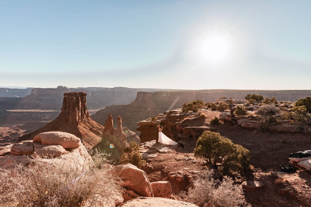 Newlyweds sharing their first kiss as a married couple at their Malboro Point elopement ceremony.