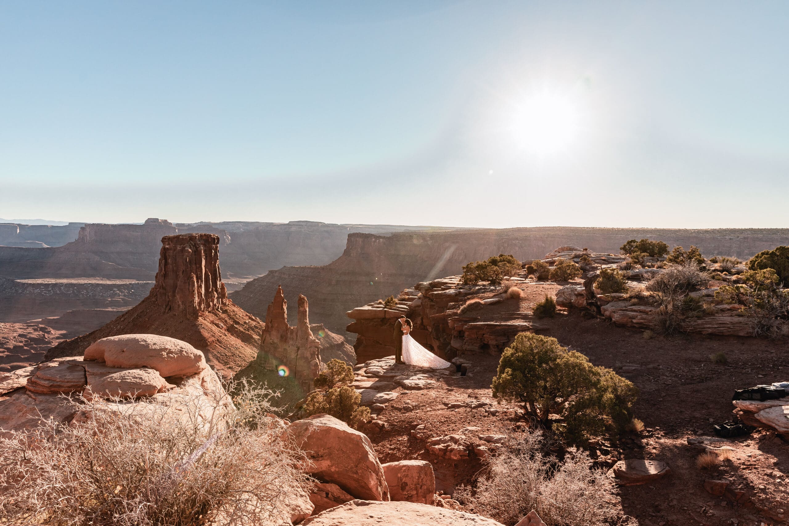 Newlyweds sharing their first kiss as a married couple at their Malboro Point elopement ceremony.