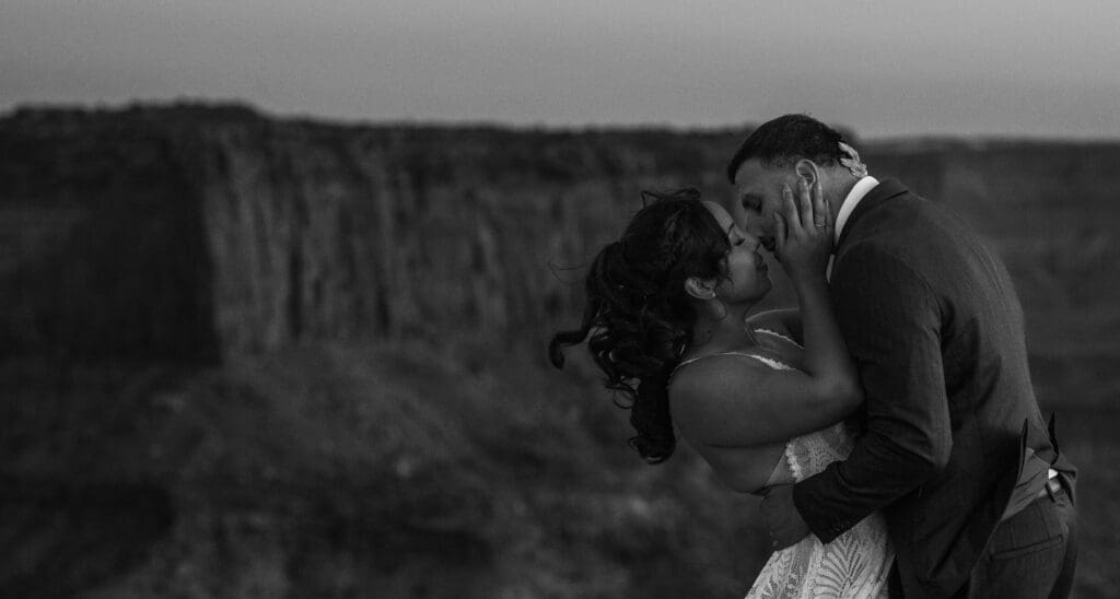 Black and white portrait capturing emotion on the couple’s faces as they embrace at Malboro Point.