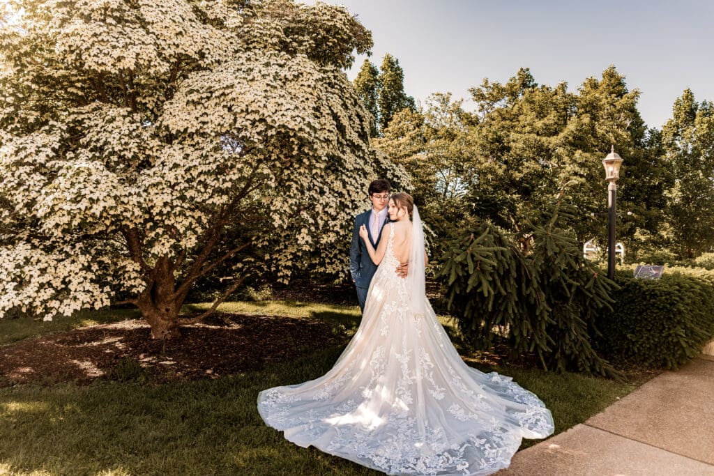 Bride and groom posing together in the outdoor gardens at Phipps Botanical Gardens in Pittsburgh