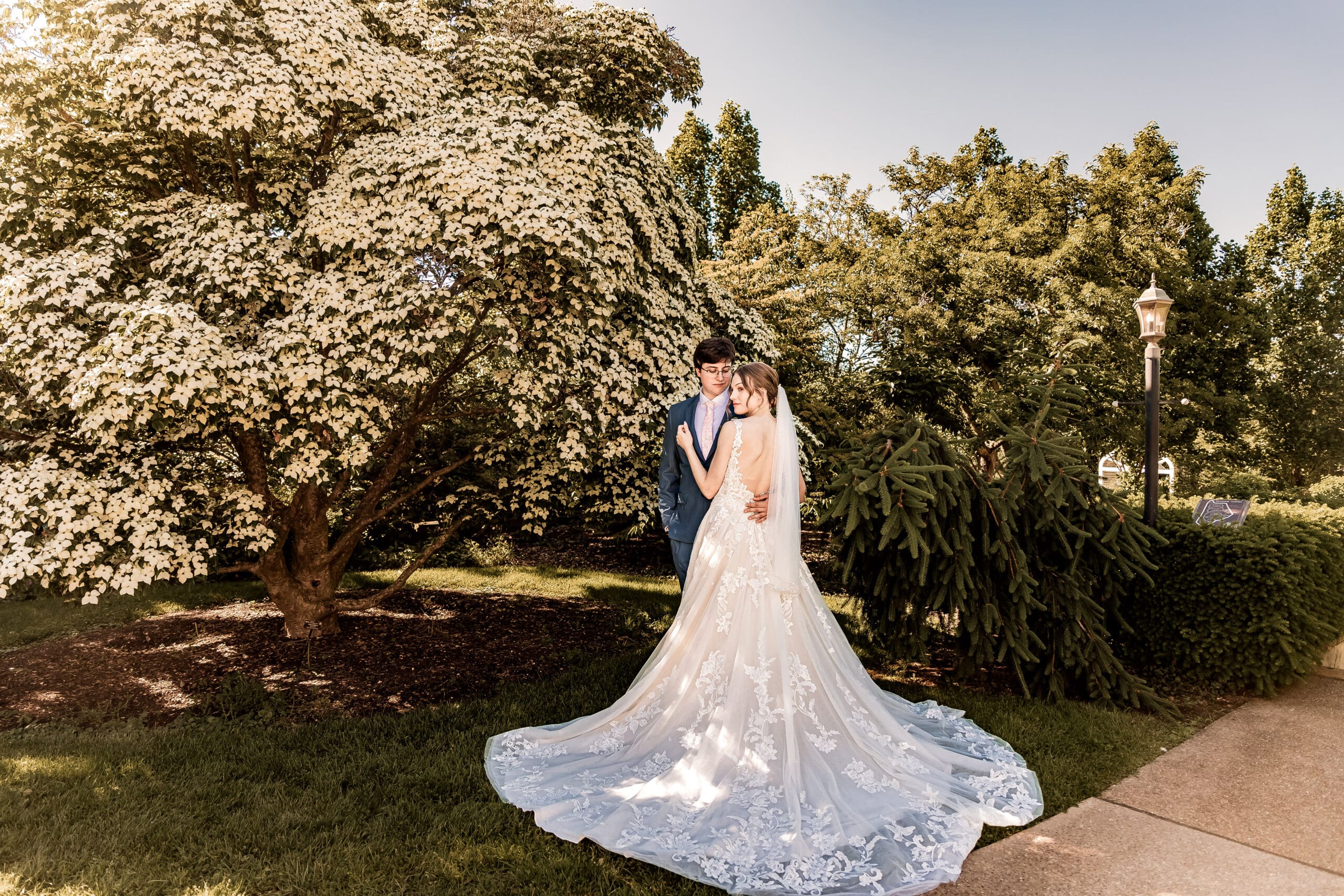 Bride and groom posing together in the outdoor gardens at Phipps Botanical Gardens in Pittsburgh