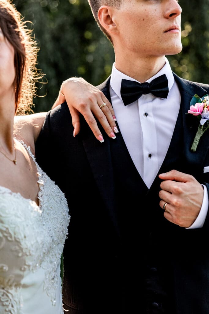 Close up of wedding rings and boutonniere during a Willowbrook wedding
