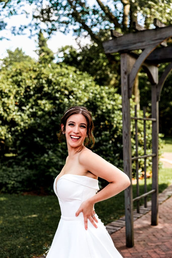 Bride laughing and posing for photos at Succop Nature Park wedding