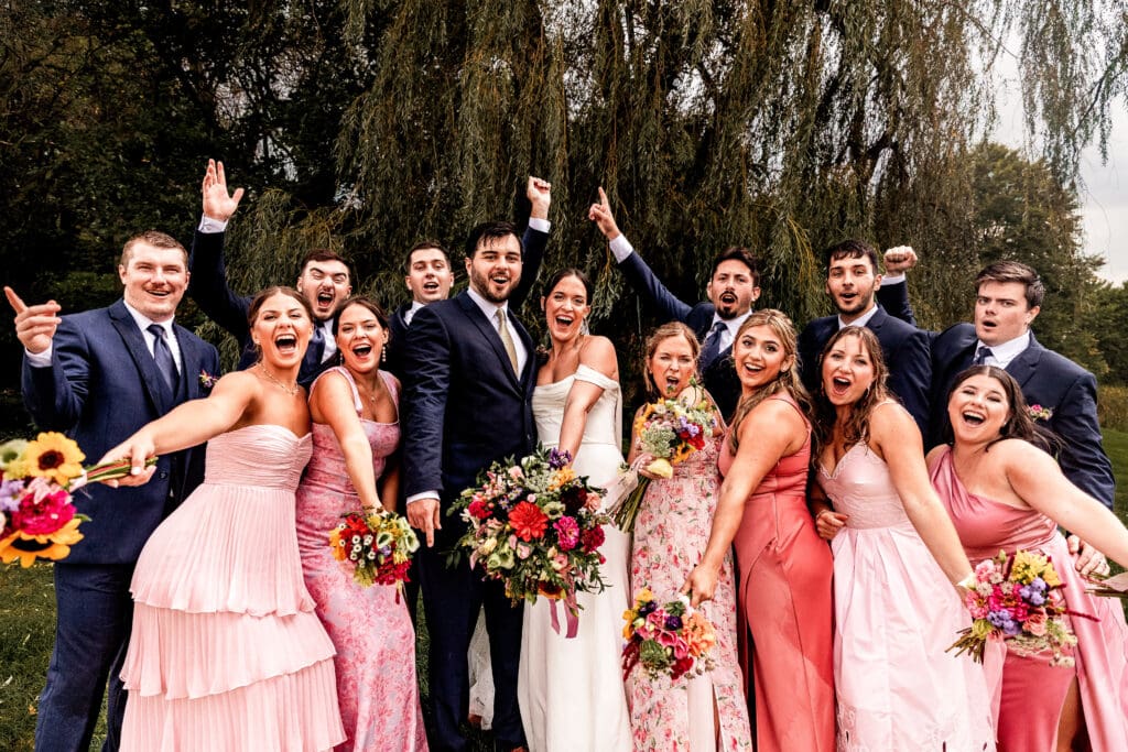 Bridal party celebrating together during a Willowbrook wedding reception in Volant, Pennsylvania