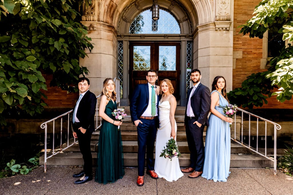 Wedding party poses in front of Phipps Conservatory in Pittsburgh