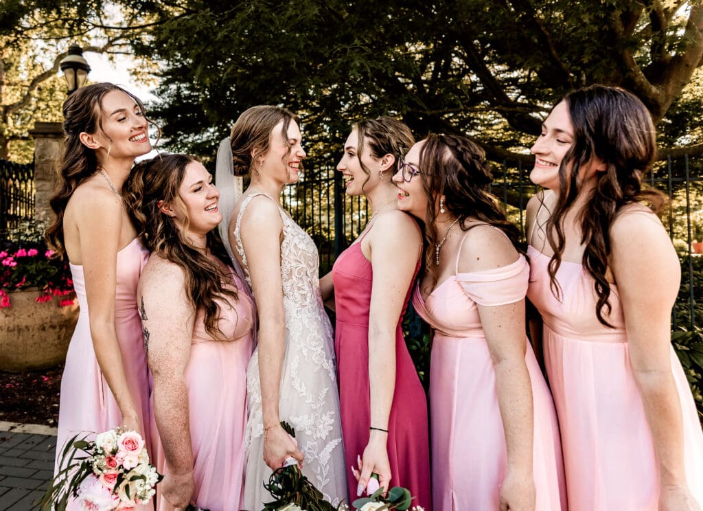 Pittsburgh bride and bridesmaids laughing together during pre-ceremony portraits at Phipps Botanical Gardens