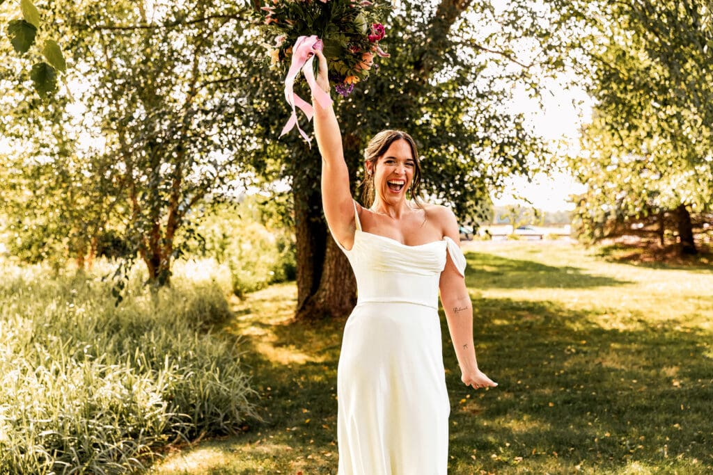 Pittsburgh bride celebrating with excitement on her wedding day at Willowbrook in Volant, PA