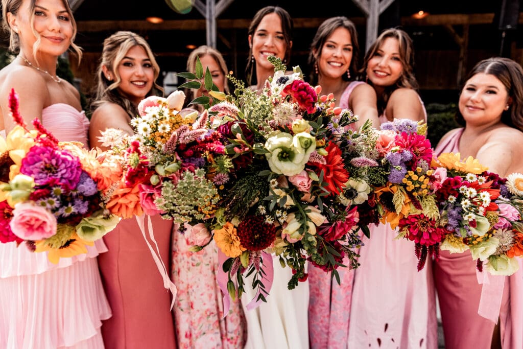 Close-up of bride and bridesmaids’ bouquets at Willowbrook wedding in Volant, Pennsylvania