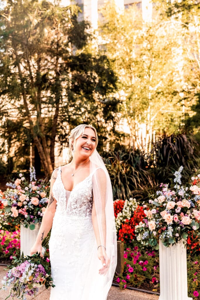 Pittsburgh bride laughing and playing with veil during wedding portraits