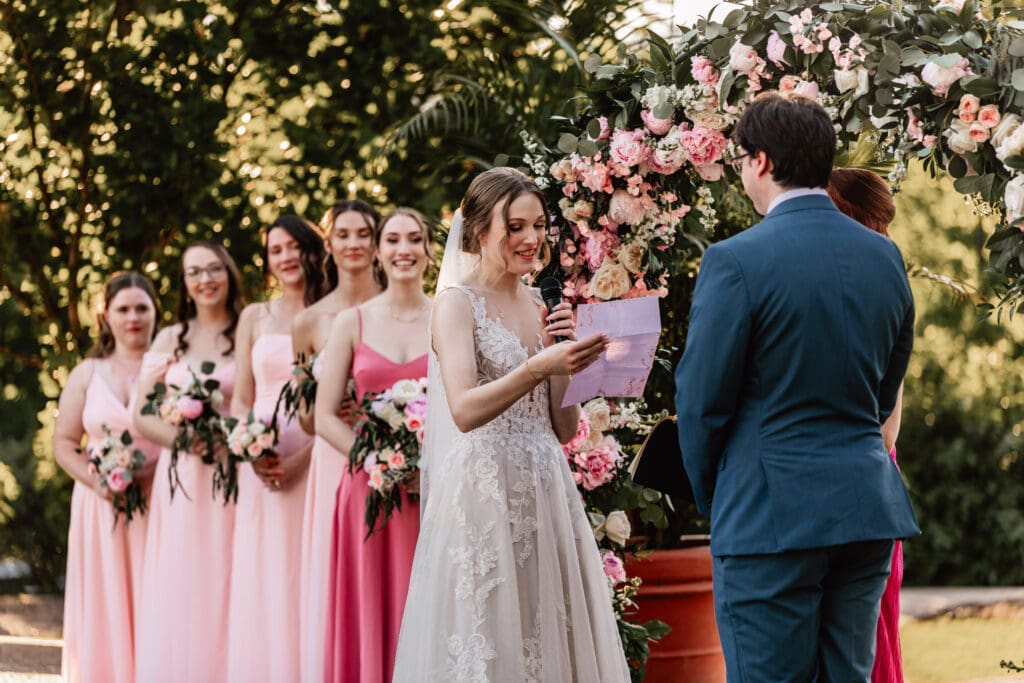 Wedding couple reads personal vows during an intimate ceremony at Phipps Botanical Garden