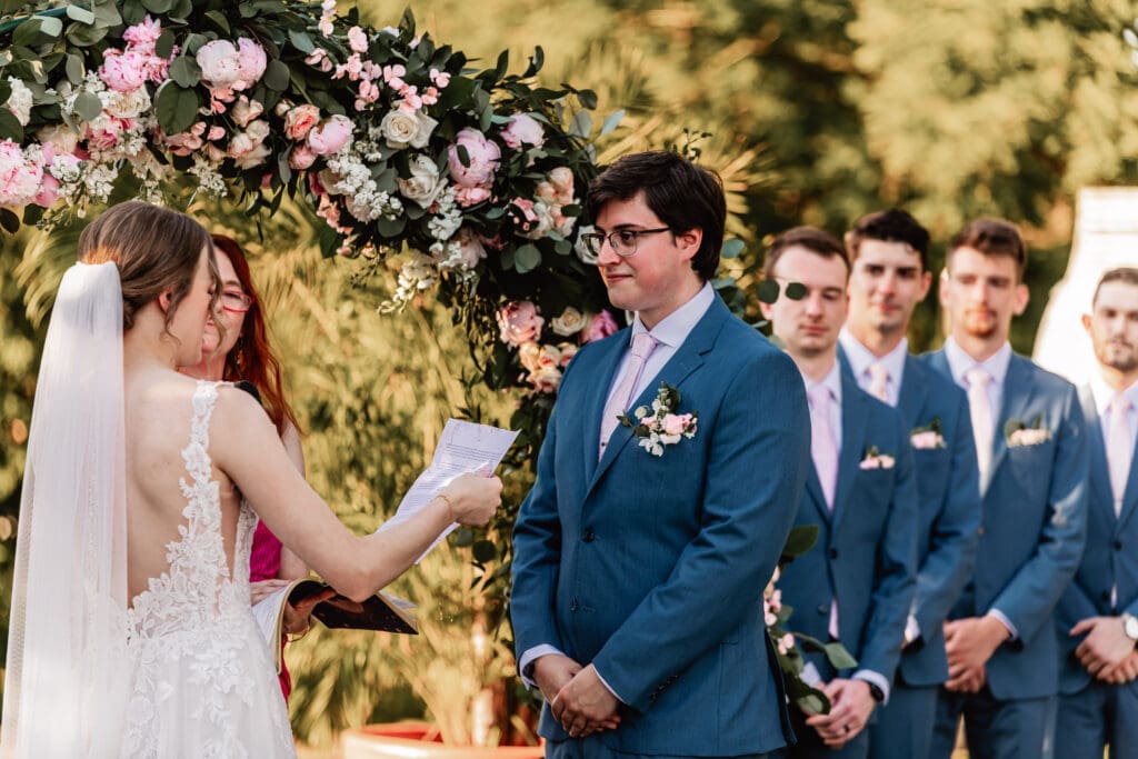 Bride and groom exchange personal vows surrounded by lush gardens at Phipps Botanical Garden