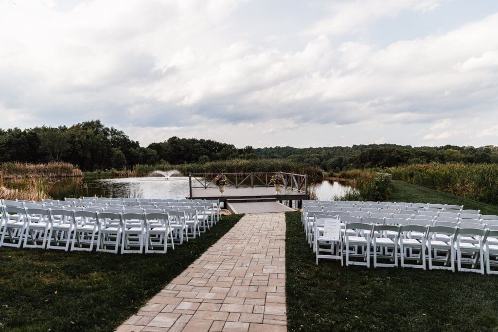 Wedding ceremony overlooking the pond and deck at Willowbrook Weddings in Volant, PA