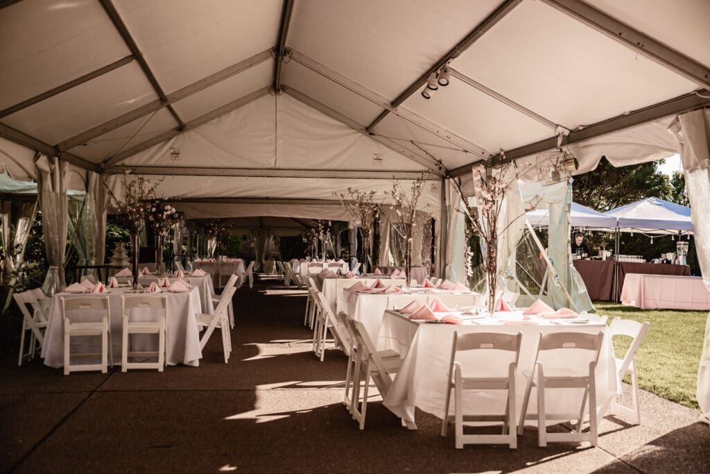 Floral cherry blossom centerpieces on reception tables at Phipps Botanical Gardens in Pittsburgh