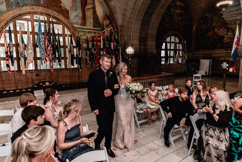 Bride walking down the aisle with her father during a Pittsburgh courthouse wedding