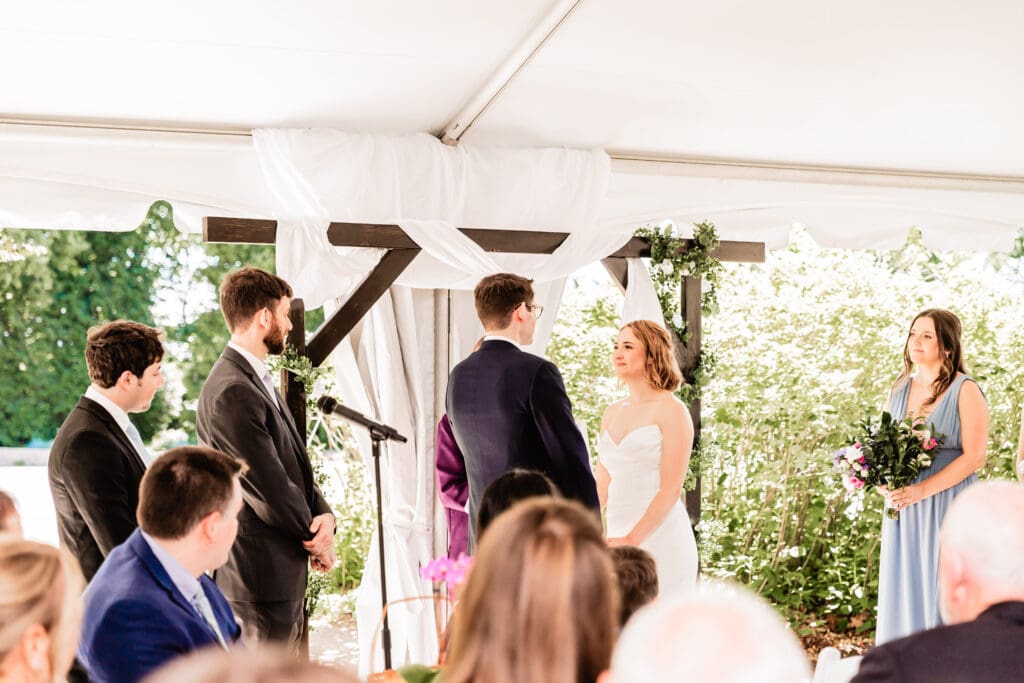 Bride reading her vows during an intimate microwedding ceremony at Schenley Park Welcome Center in Pittsburgh