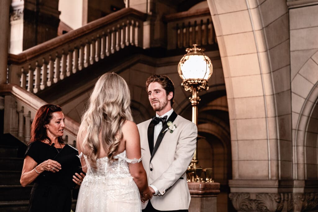 Wedding couple holding hands during their Allegheny County Courthouse ceremony