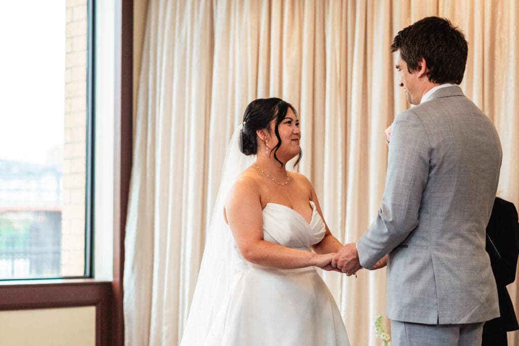 ouple shares an emotional vow exchange at their Sheraton Station Square wedding