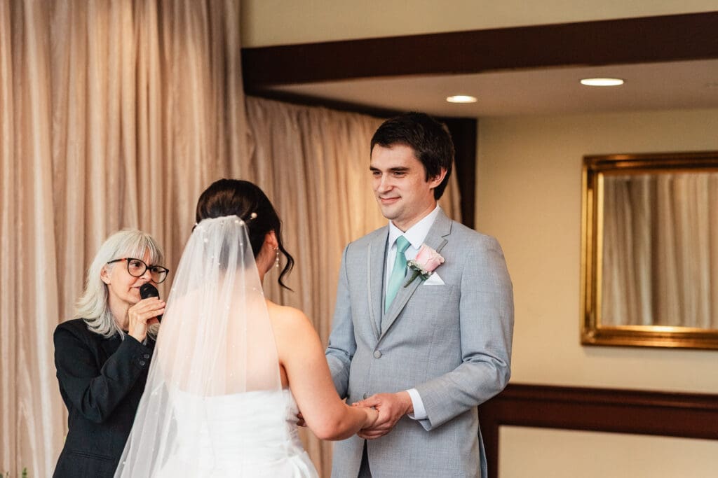 Bride and groom exchange vows during their Sheraton Station Square wedding ceremony
