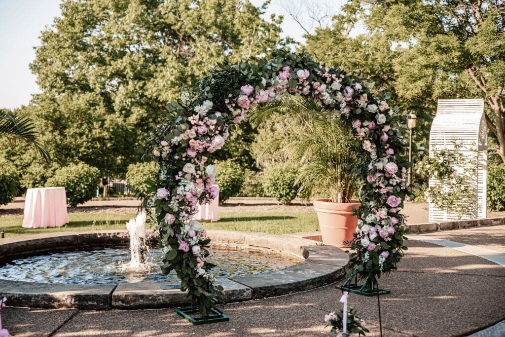 Floral circular arbor in the outdoor garden at Phipps Botanical Gardens decorated for a Pittsburgh wedding ceremony