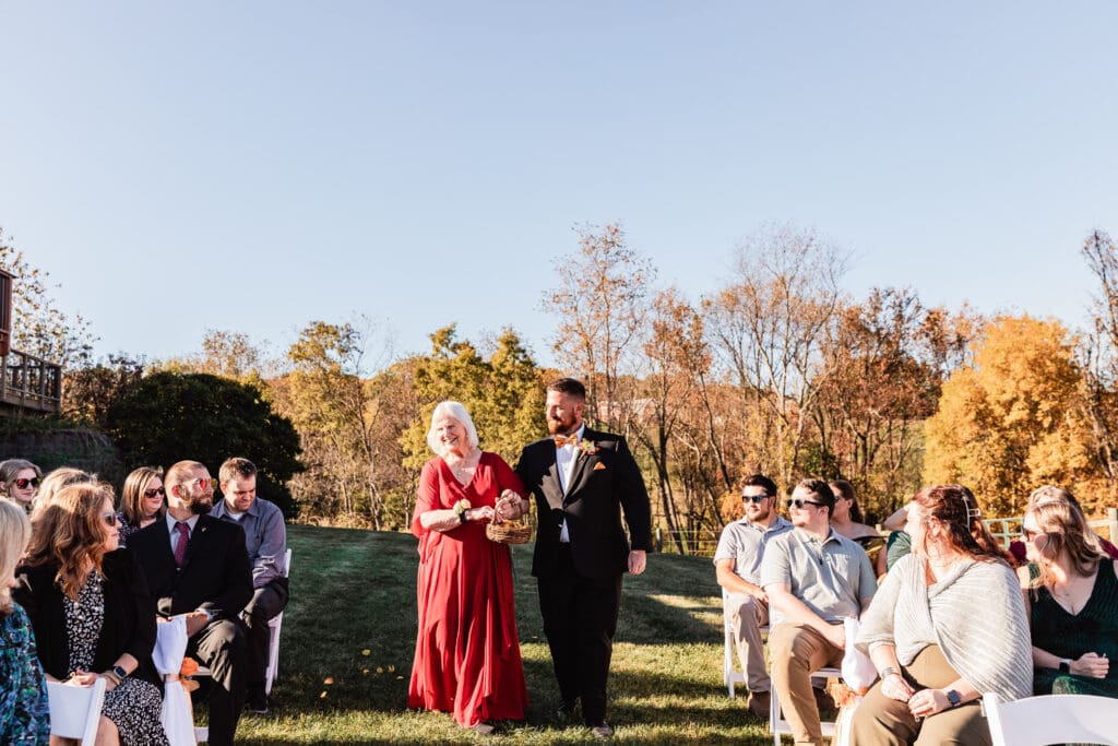 Flower grandma is escorted down the aisle during a wedding ceremony in Beaver County