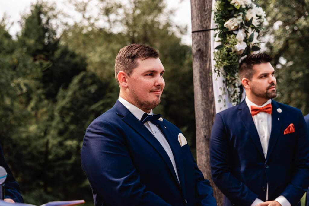 Groom catching his first glimpse of the bride as she walks down the aisle at The Barn at Ever Thine in Fenelton, PA