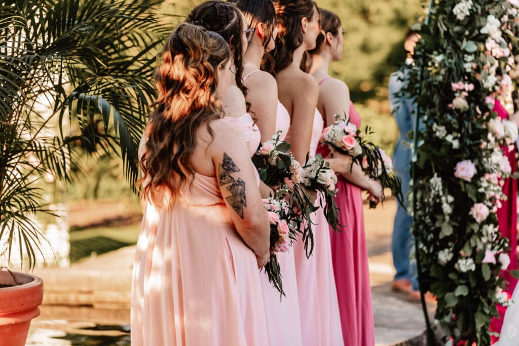 Bridesmaids standing at the altar during a Phipps Botanical Gardens wedding ceremony in Pittsburgh
