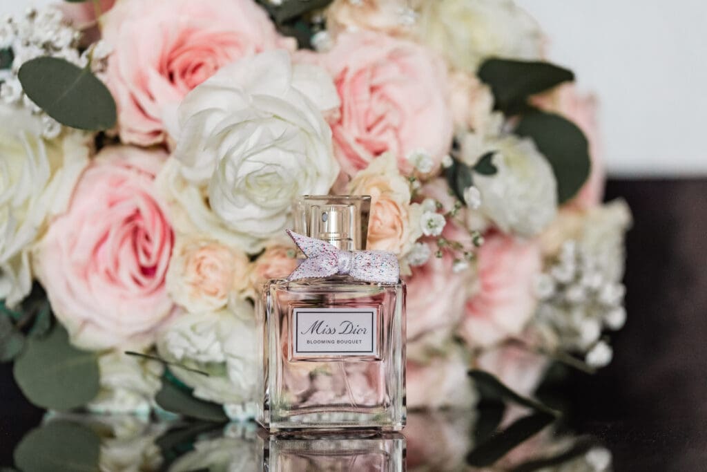 Miss Dior perfume bottle styled with florals during Sheraton Station Square wedding