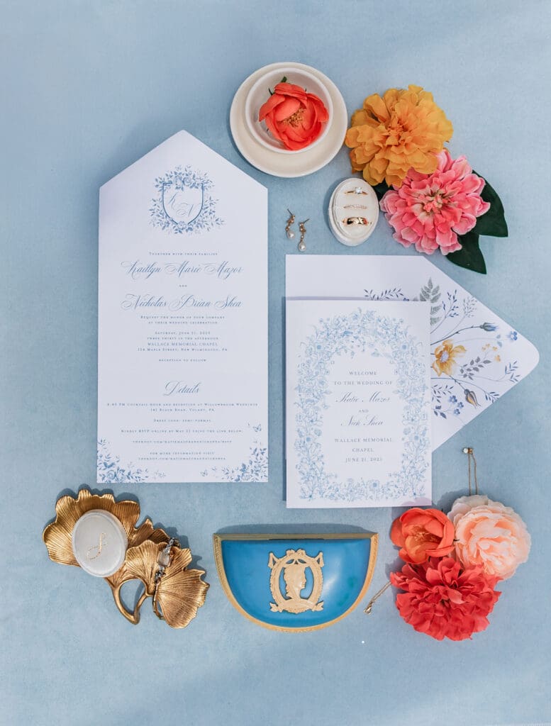 Elegant blue and white wedding invitation suite with floral accents