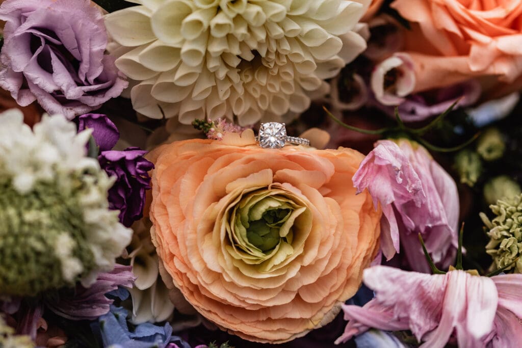 Close up of colorful bridal bouquet with engagement ring from Dormont Florist at Pittsburgh Airport Marriott wedding