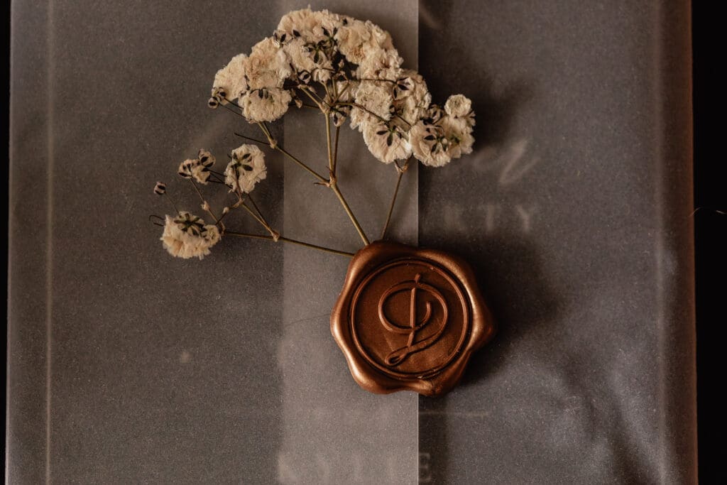 Wedding invitation with personalized wax seal and dried florals for a Pittsburgh courthouse wedding