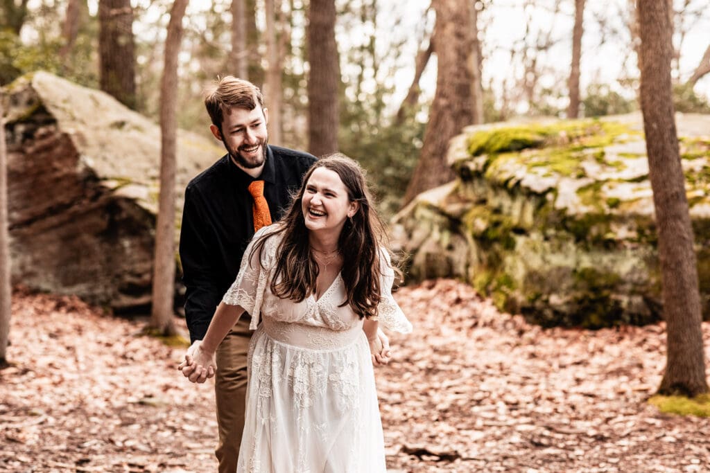 Engaged couple being playful and carefree during their Coopers Rock State Park engagement session