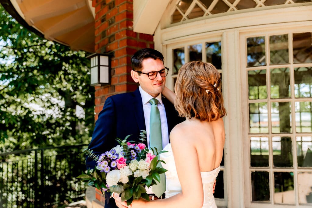 Bride and groom standing close and sharing an emotional first look at their Pittsburgh microwedding