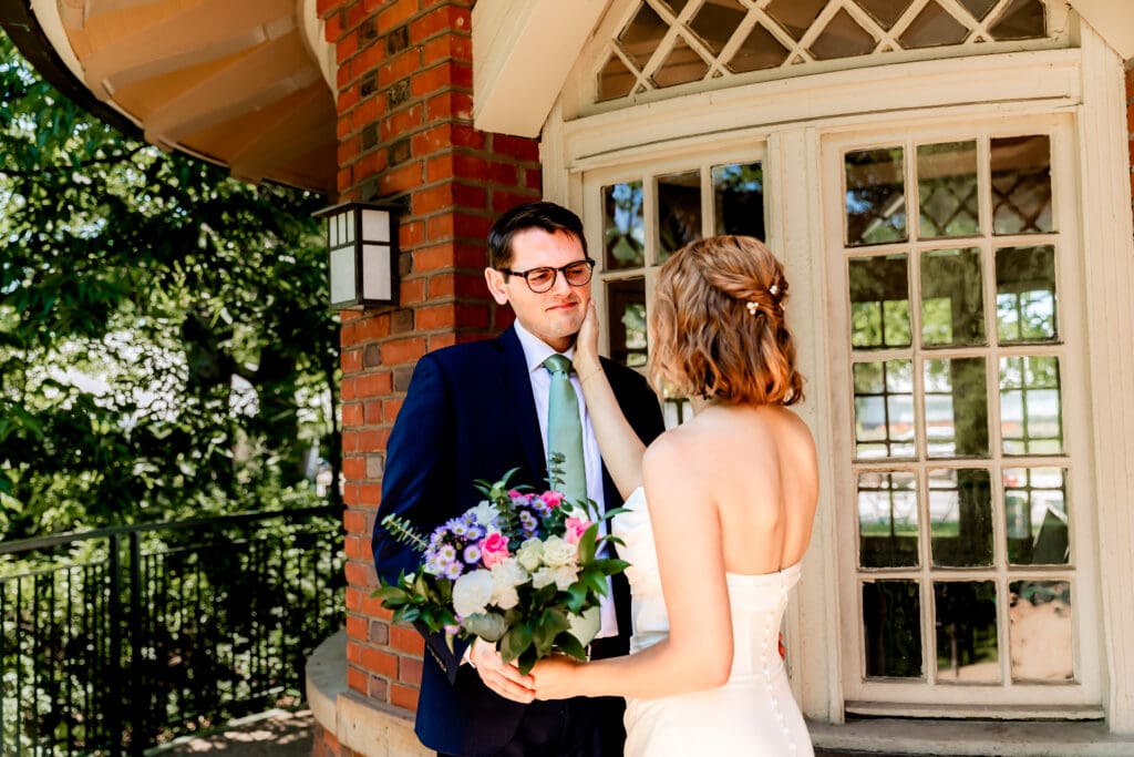 Groom reacting emotionally during the first look at his Schenley Park Welcome Center wedding
