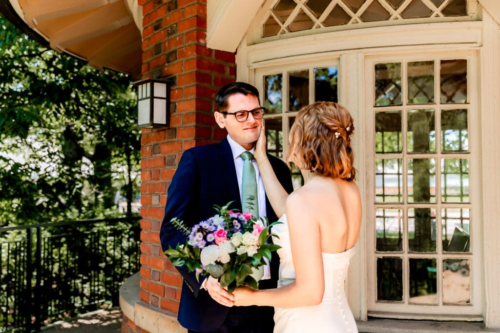 Groom overwhelmed with emotion seeing his bride for the first look at Schenley Park Welcome Center in Pittsburgh