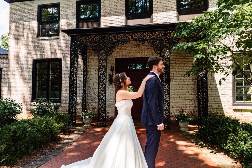 Bride and groom enjoying private first look in lush greenery at Succop Nature Park
