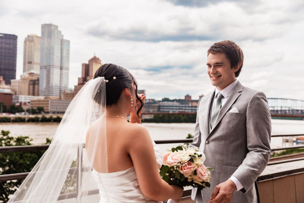 Groom turns around to see bride during first look at Sheraton Station Square