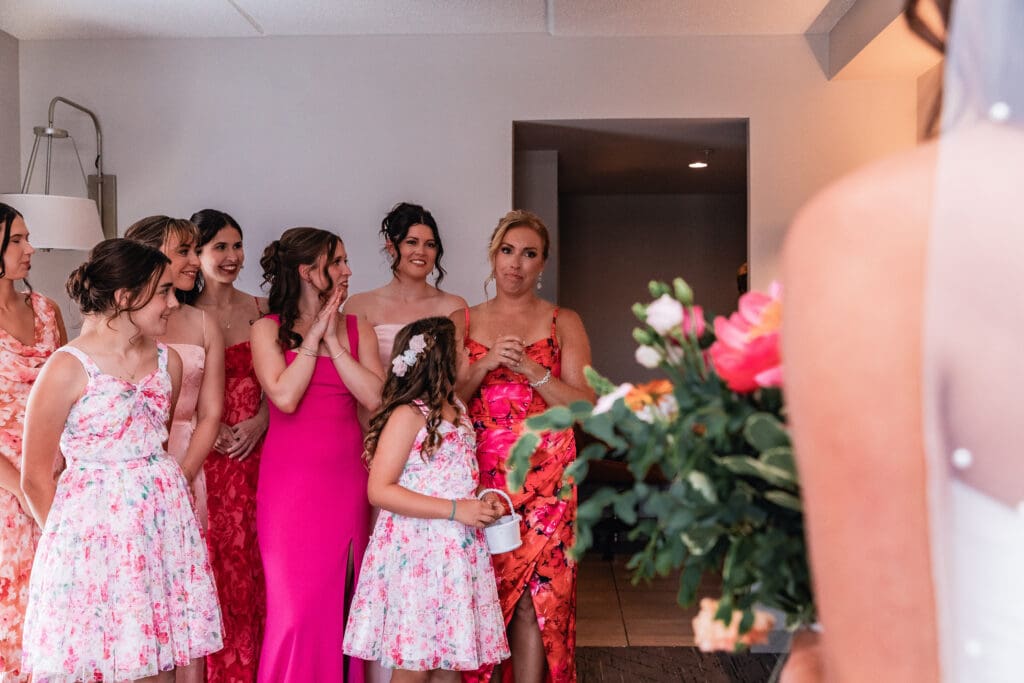 Bridesmaids crying and smiling during first look at National Aviary wedding