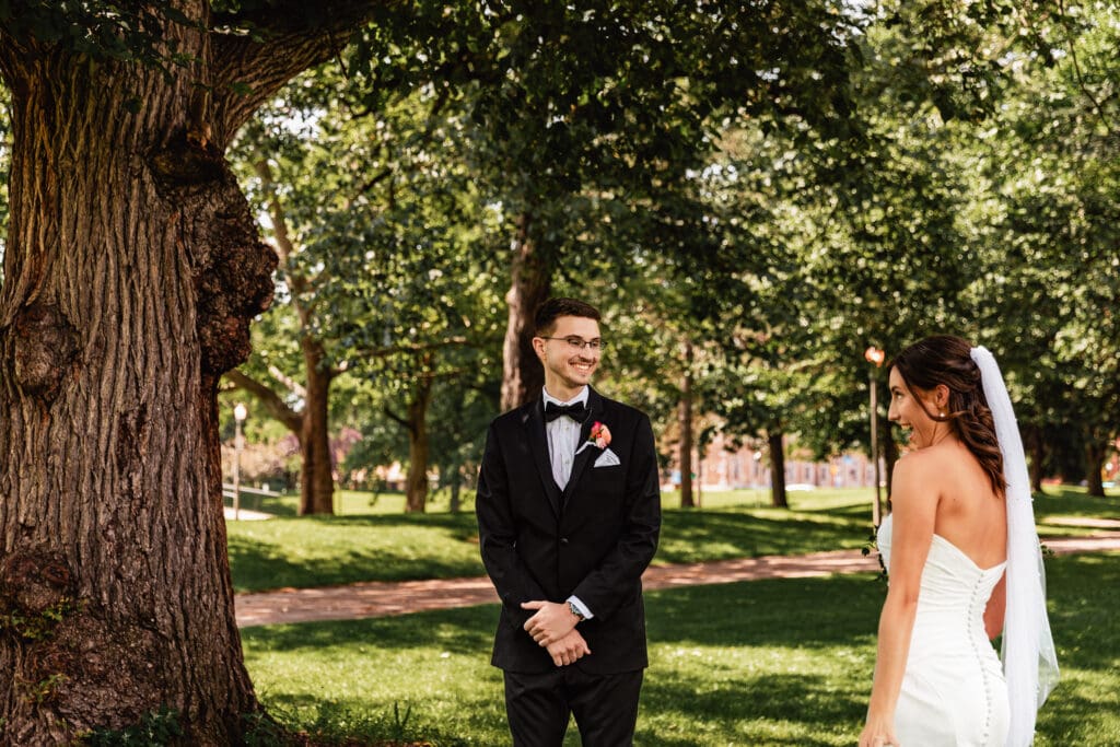 Groom seeing bride for the first time during wedding first look at the National Aviary