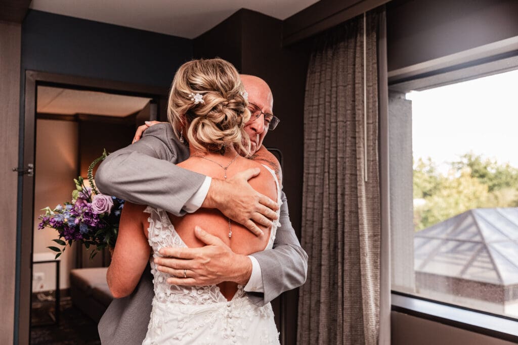 Pittsburgh bride and her father share an emotional embrace after first look
