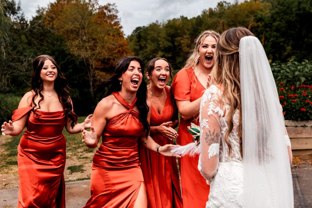 Emotional bridesmaid first look with bride at Hinckston Run Farm