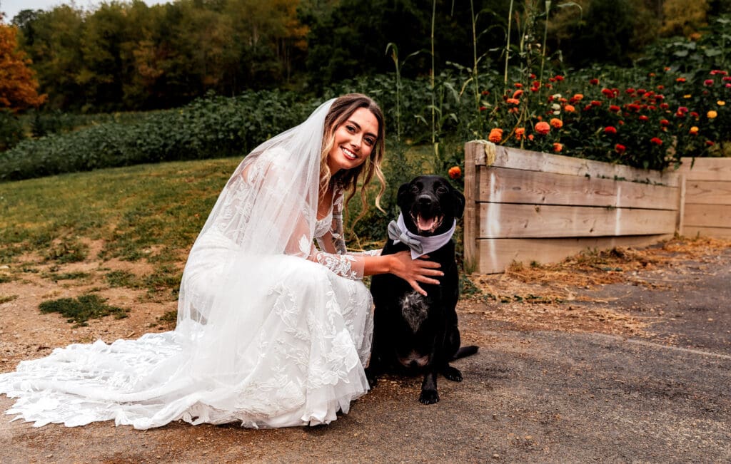 Bride sharing first look moment with her dog at Hinckston Run Farm wedding
