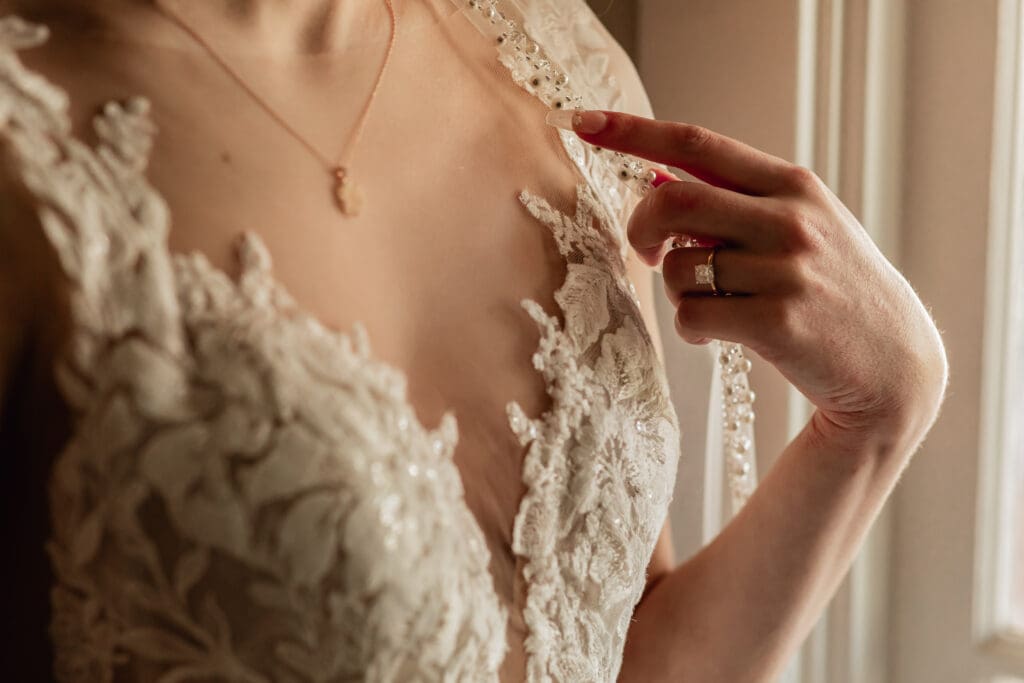 Close-up of bride’s engagement ring and necklace during preparations at Phipps Botanical Gardens in Pittsburgh