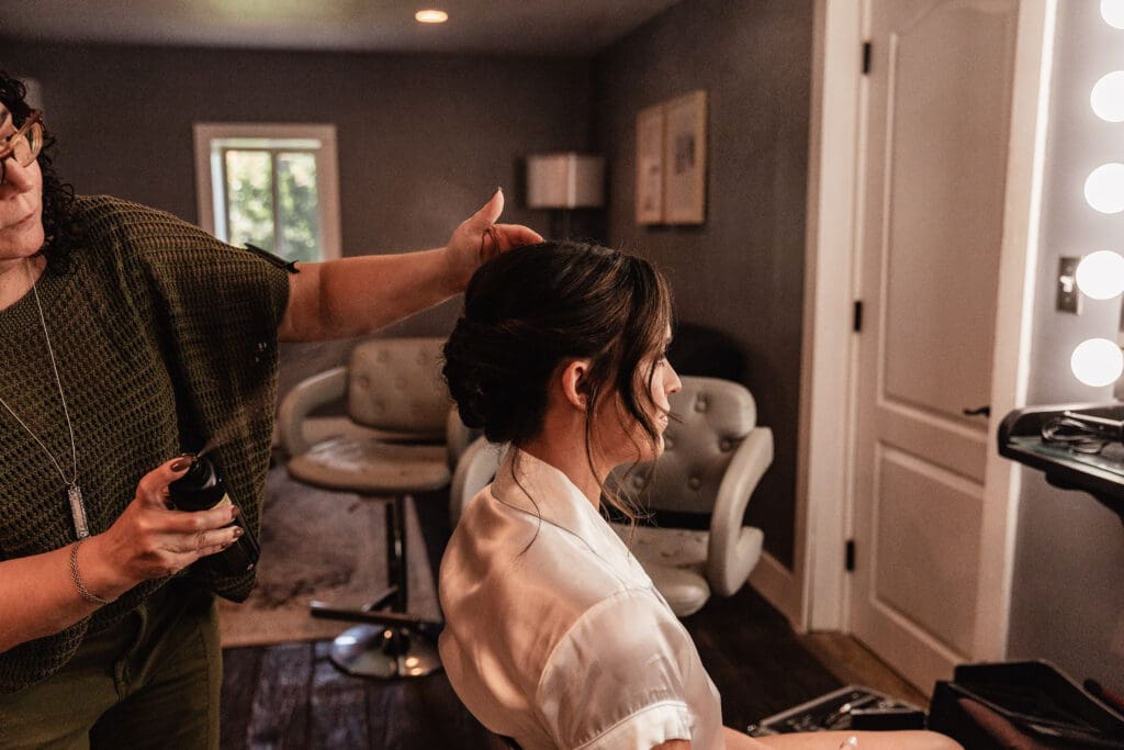 Bride getting ready in the Willowbrook bridal suite before her wedding in Volant, Pennsylvania