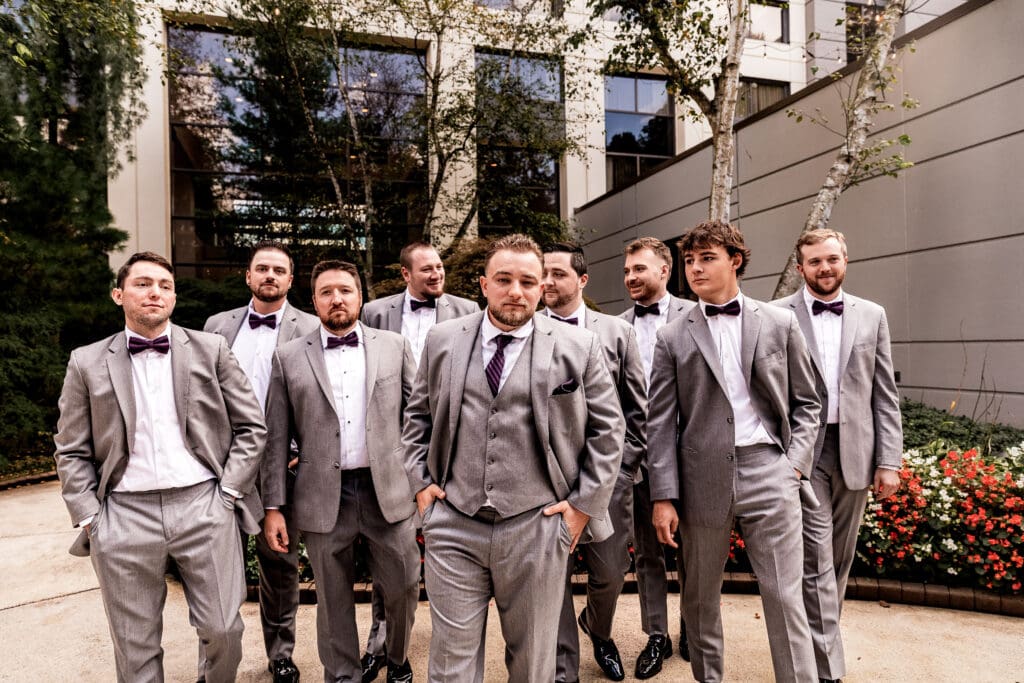 Groom and groomsmen walking toward the camera at Pittsburgh Airport Marriott wedding