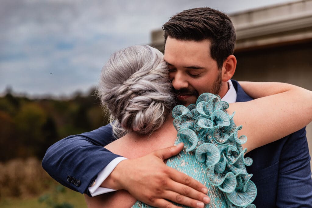 Groom shares emotional first look with his mom at Hinckston Run Farm