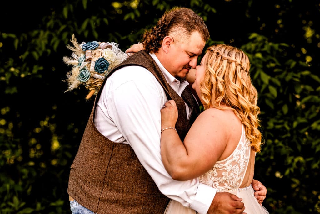 Bride and groom sharing a quiet moment alone in a field during their family farm wedding in Monongahela, Pennsylvania