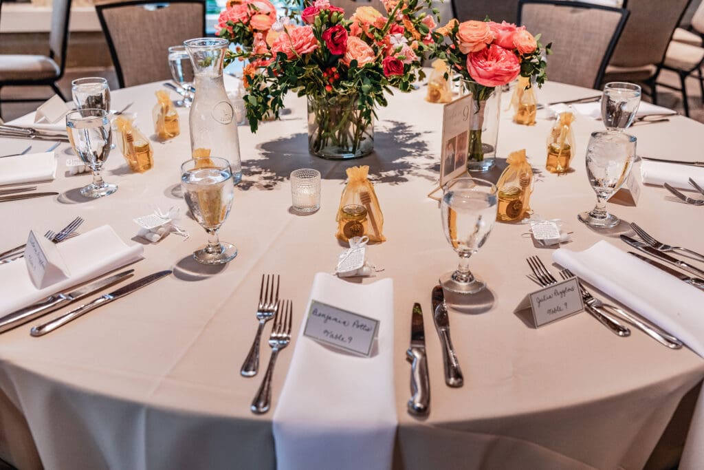 White plates with handwritten names used as elegant place settings at National Aviary wedding reception