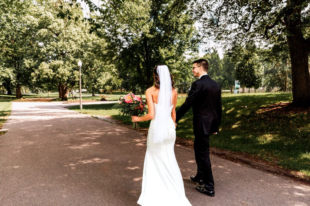 Bride and groom sharing a quiet wedding portrait moment at Allegheny Commons Park near the National Aviary