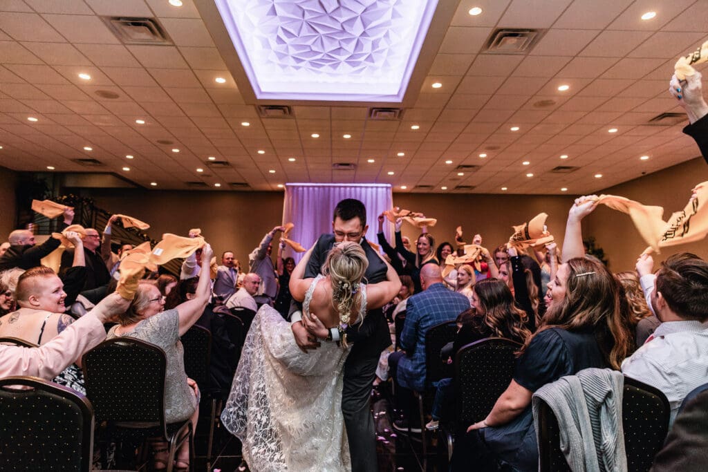 Bride and Groom dip kiss after their ceremony at The Fez